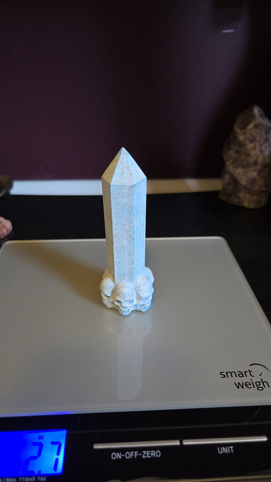 Dyed blue howlite tower w/skulls(unpolished)